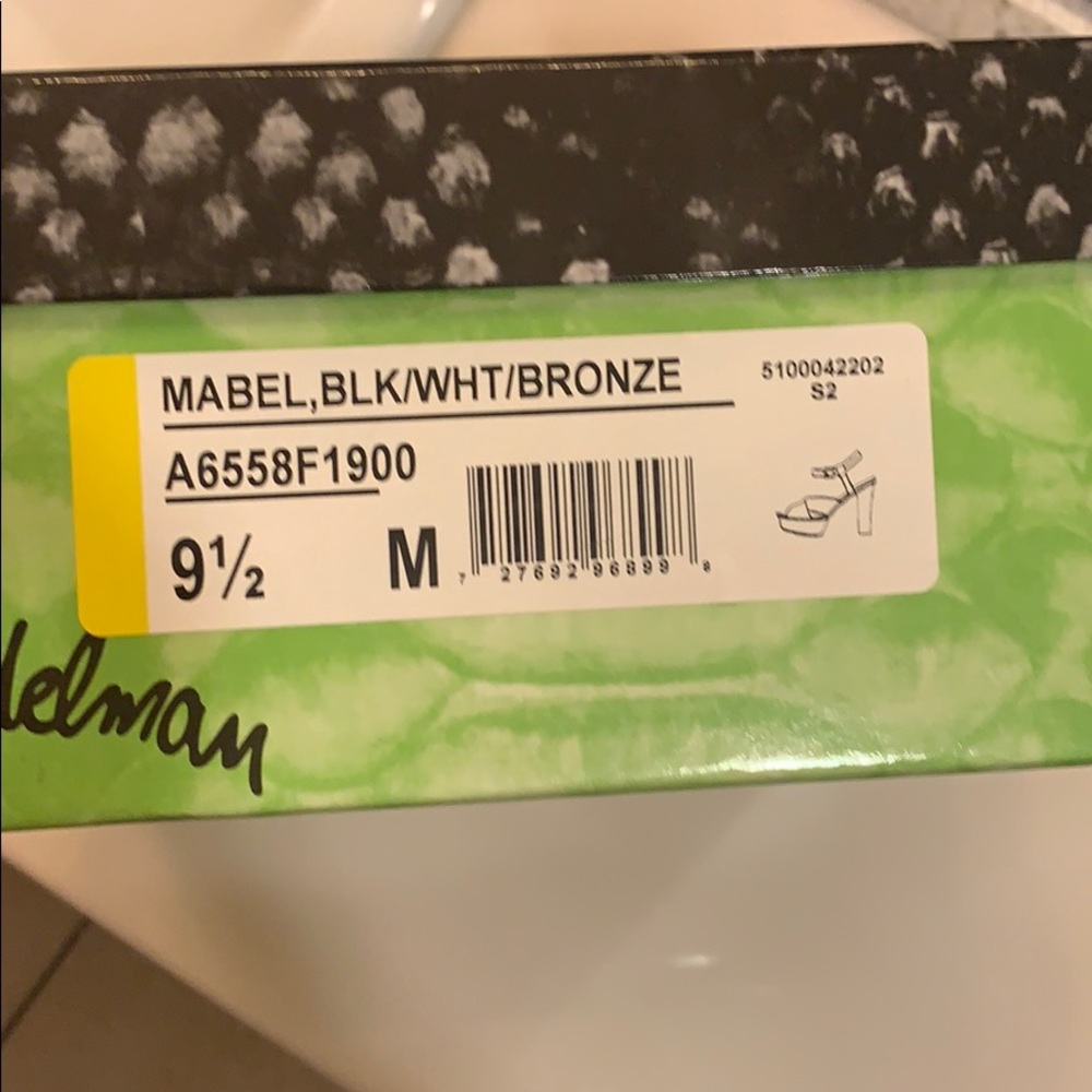 Black and white sam Edelman summer heels.